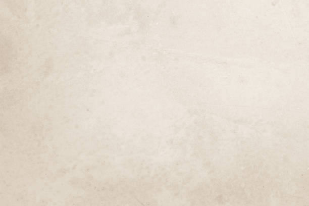 istock Colour old concrete wall texture background. Close Up retro plain cream color cement wall background texture. Design paper vintage parchment element show or advertise or promote product on display. 1492181898