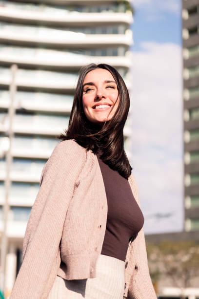 istock cheerful woman smiling taking a walk at city 1492181990