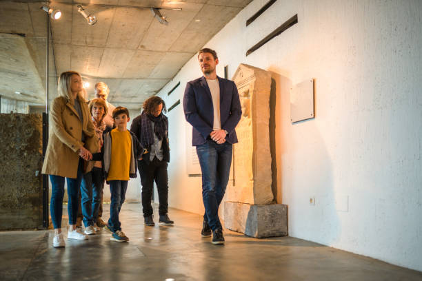 istock Mid Adult Caucasian Museum Guide and Group 1492185079