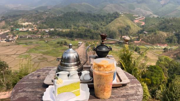 istock Thai ice tea and lemon cake surrounded by beautiful valley. 1492192809