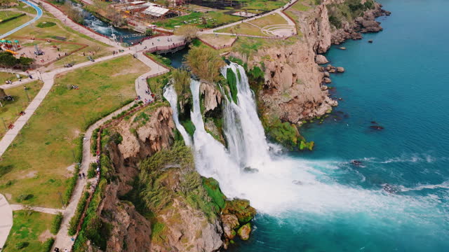 Duden waterfall dropping in Mediterranean Sea in Antalya, Lara Antalya in a bright sunny day, Lower Duden Waterfalls, high waterfall pouring into the sea, the waterfall in the city falls into the sea, turkey's famous tourism destination, the highest water