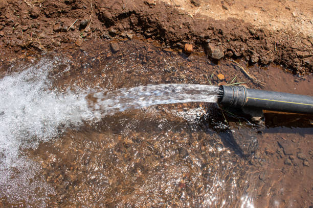 istock pump pipe water flow equipment agriculture, irrigation water from the source, water flow from large pump tube in farm 1492198963