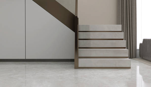 istock Luxury, modern L shape granite stone staircase, tempered glass panel, gold steel handrail, storage under stairs in beige wall hall in sunlight from window on marble floor 1492201805