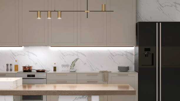 istock Modern wood dining table, marble island, pendant light in luxury beige kitchen counter, hidden light, splash back, cabinet, cupboard, refrigerator 1492202104
