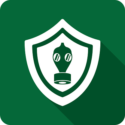 Vector illustration of a shield with gas mask icon against a green background in flat style.