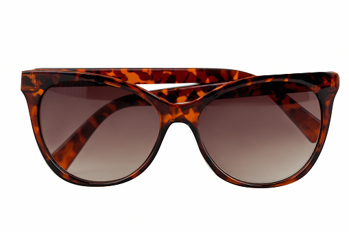 Sunglasses with red and black frame pattern, white background, cut out, clipping path