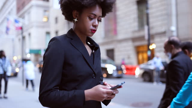 In the Fast Lane: Busy Young Black Businesswoman on Wall Street
