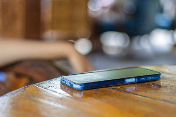 istock A mobile phone lying on a wooden table 1492205795