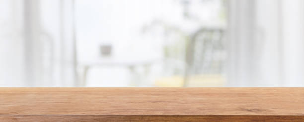 istock Empty wood table top and blurred bed room of home interior with window room background. - can used for display or montage your products. 1492206257