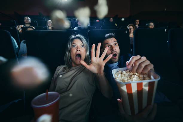 watching a horror movie in cinema! - audience surprise movie theater shock imagens e fotografias de stock