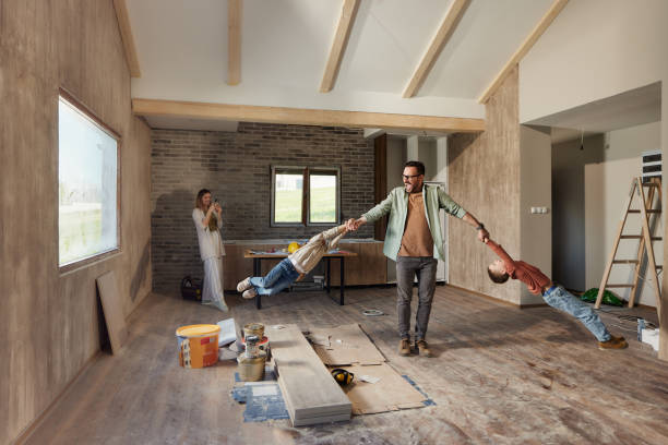 istock Cheerful family having fun during home renovation process. 1492207162