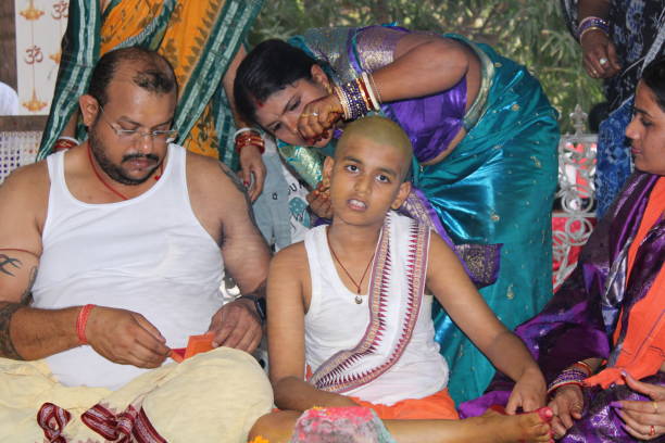 istock Bratopanayan in progress in an Odia household. Ear piercing. 1492213535