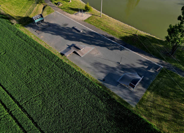 istock Skateboard park with concrete cement surface with concrete skateboard obstacles 1492213598