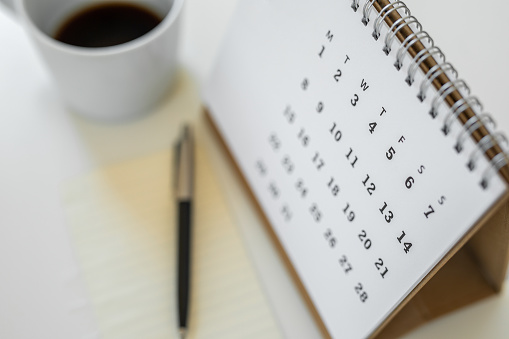 Calendar schedule with a cup of coffee and blank note for to do list