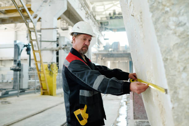 istock Foreman using tape measure to measure the stone 1492217343