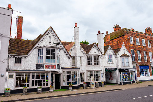 Witham, Essex, England, UK - May 21, 2023: Wide view of the traditional city architecture on the high street in Witham town with no people on the street