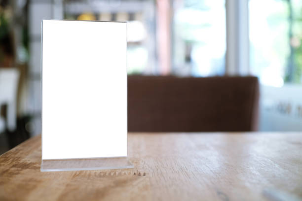 istock Menu frame standing on wood table in Bar restaurant cafe. space for text marketing promotion. 1492219668