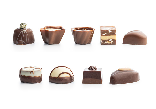 Sweet chocolate pralines.  Tasty chocolate truffles isolated on the white background.