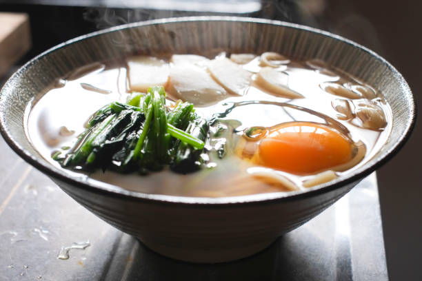 istock Udon noodles with a raw egg on top. 1492224848