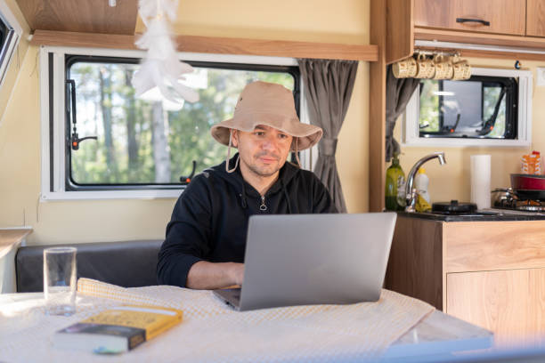 istock The Man İn His Caravan Works On  A Laptop 1492231027