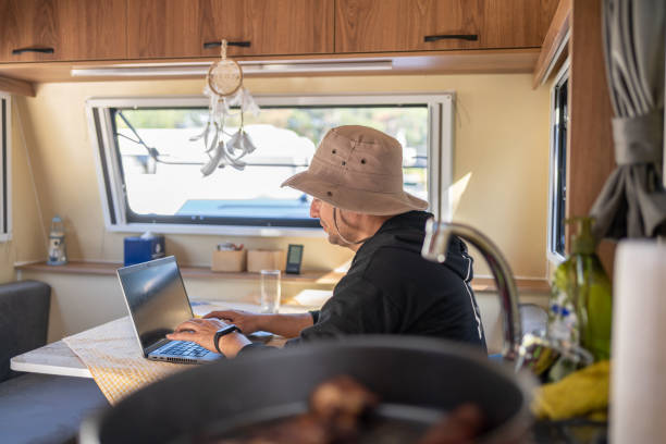 istock The Man İn His Caravan Works On  A Laptop 1492232112