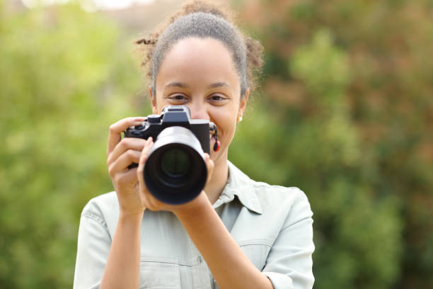 istock Happy black photographer looking at camera 1492239004