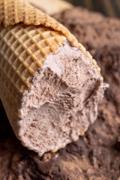 istock chocolate ice cream in a waffle cup on chocolate 1492243695