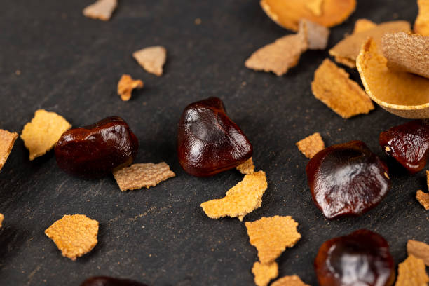 istock brown tamarind seeds on the table, scattered seeds 1492245395