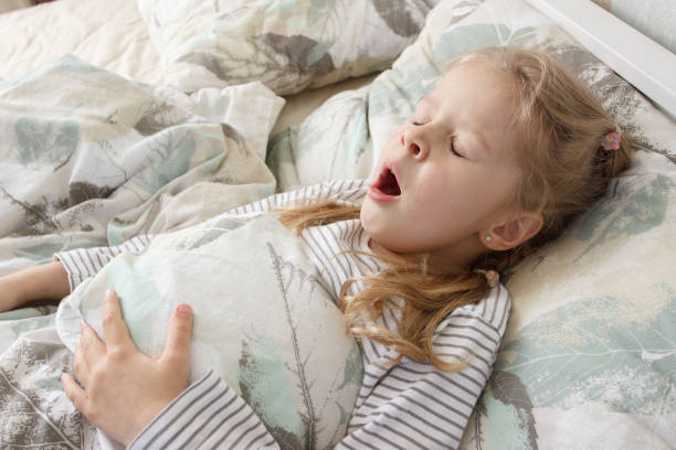 istock Little cute kid sleeping in the bed. Concept of resting 1492246692