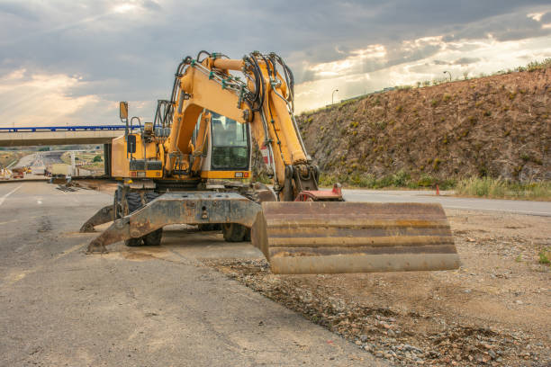 istock Excavator building a road in a site construction 1492246947