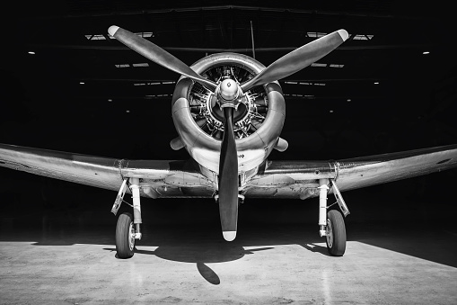 Vintage Douglas DC-3 propellor airplane ready for take off at the runway of an empty airfield. Image with a retro look.