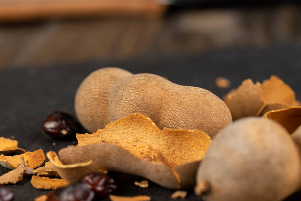 istock long ripe tamarind pods close up 1492254499