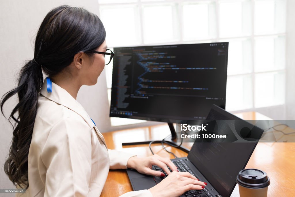 Asian Programmer Woman Working On Computer And Typing Source Code For ...