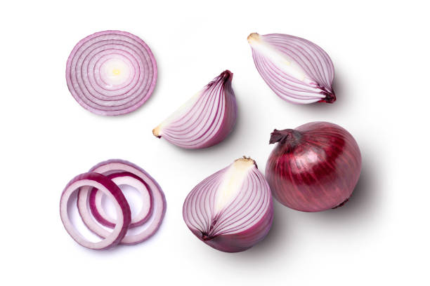 red onion and cut in half sliced isolated on white Fresh red onion and cut in half sliced isolated on white background, top view, flat lay. spanish onion stock pictures, royalty-free photos & images