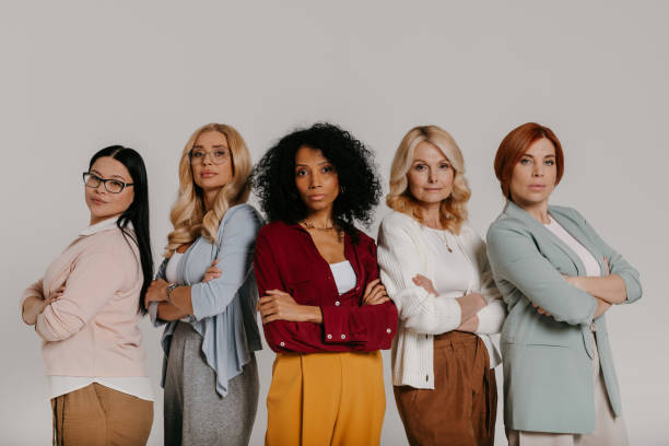 istock Multi-ethnic group of confident mature women looking at camera against grey background 1492268309