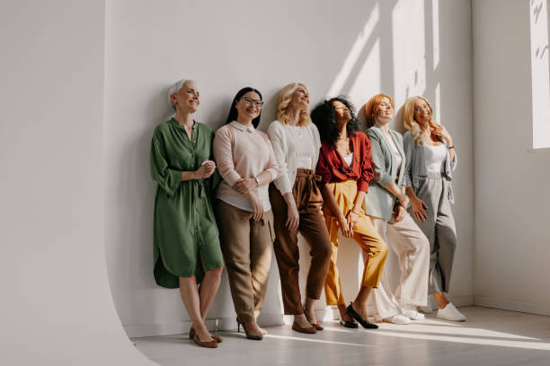 istock Multi-ethnic group of mature women bonding and smiling while leaning on the wall together 1492269006