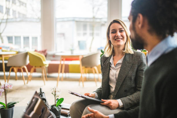Diverse Colleagues Discussing Business In A Cafe