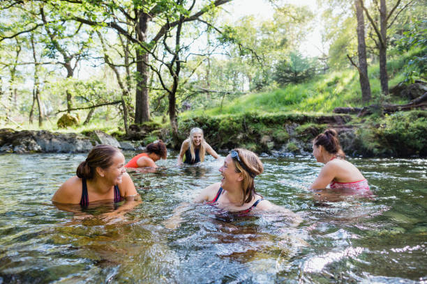 istock Women Dipping in the River 1492272326