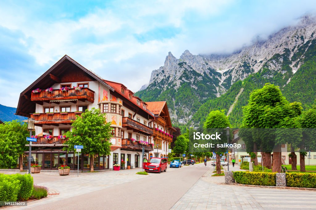 Beauty local houses in Mittenwald, Germany Mittenwald, Germany - July 01, 2021: Beauty local houses in Mittenwald old town in Bavaria, Germany Mittenwald Stock Photo