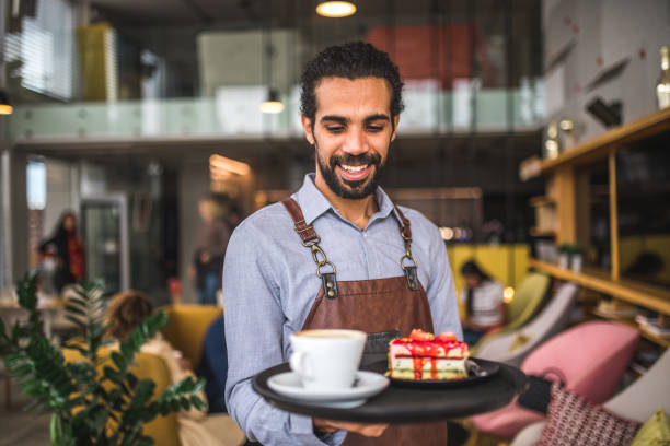 istock Middle Easter Waiter Holding A Serving Tray In A Cafe 1492278298
