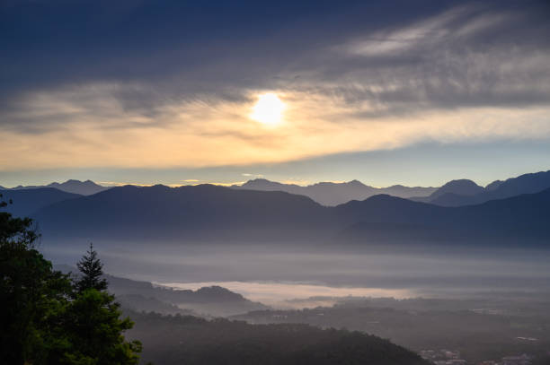 istock Cloud gap light (Crepuscular Ray) shining on the village. 1492282998