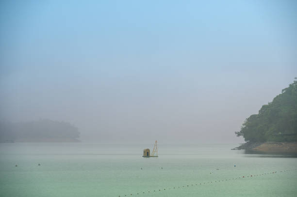 istock Dynamic clouds and wispy fog, delicate ripples on the lake. 1492283023