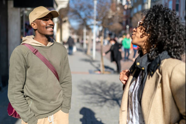 istock Afro couple walking on city streets and talking. 1492283200