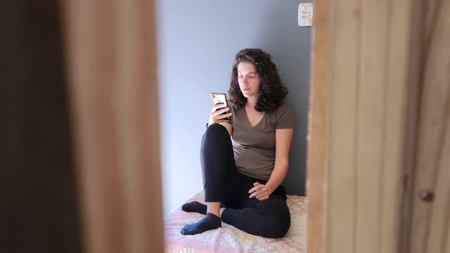Anxious woman with cell phone