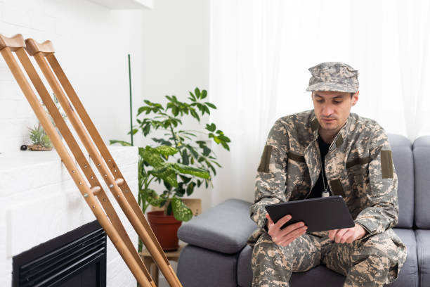 istock military man on crutches with tablet doctor 1492286336