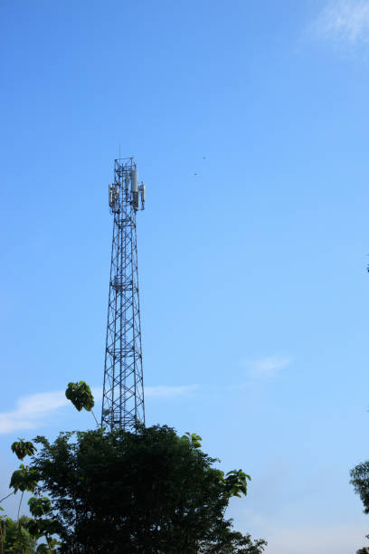 istock Communication Tower with Antenna and GSM from operator signals in Indonesia under the bright blue sky 1492286996