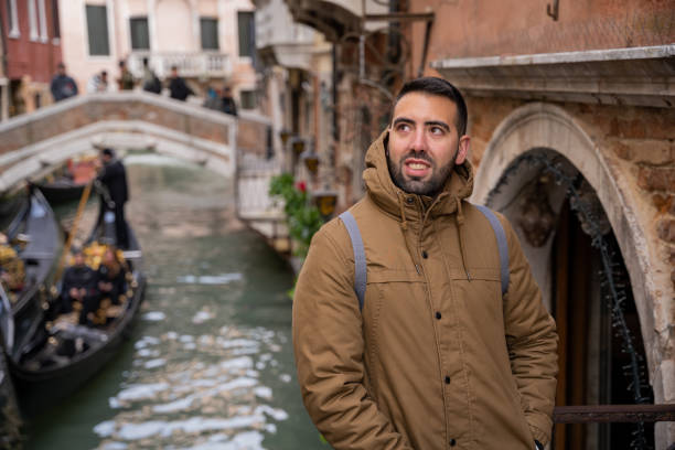 istock Young male tourist visiting Venice canals 1492289013