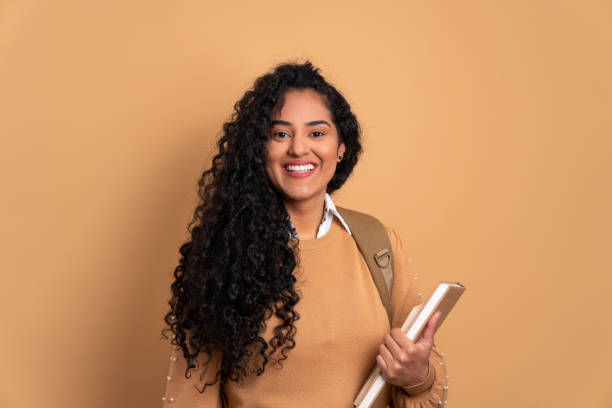 woman going to school and carrying books