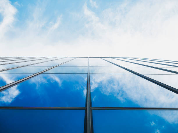 istock Modern building Glass facade with Sky reflection Architecture details 1492289211
