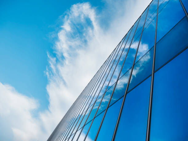istock Modern building Glass facade with Sky reflection Architecture details 1492289247